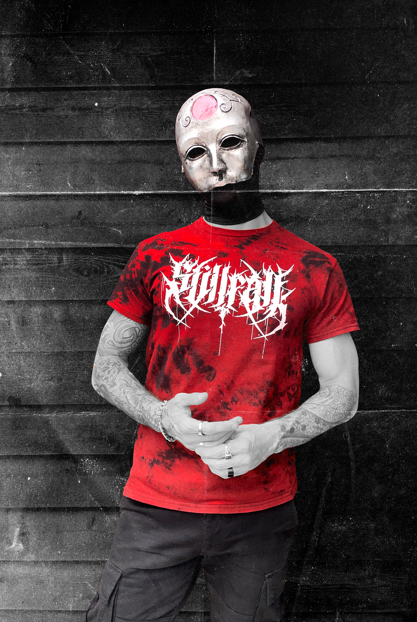 Model wearing a red & black tie-dye shirt featuring a white Stillfall logo
