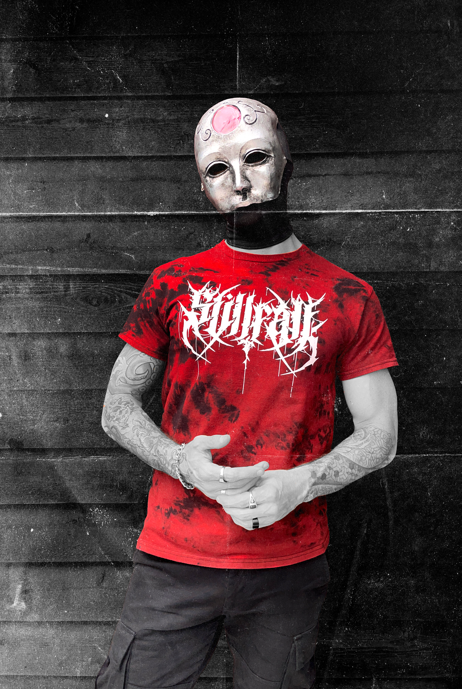 Model wearing a red & black tie-dye shirt featuring a white Stillfall logo