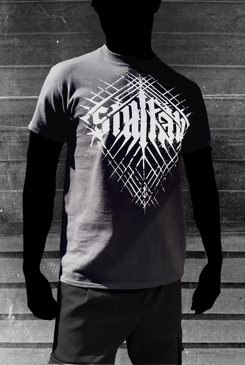 Model wearing a Black t-shirt with white latticed "Stillfall" logo